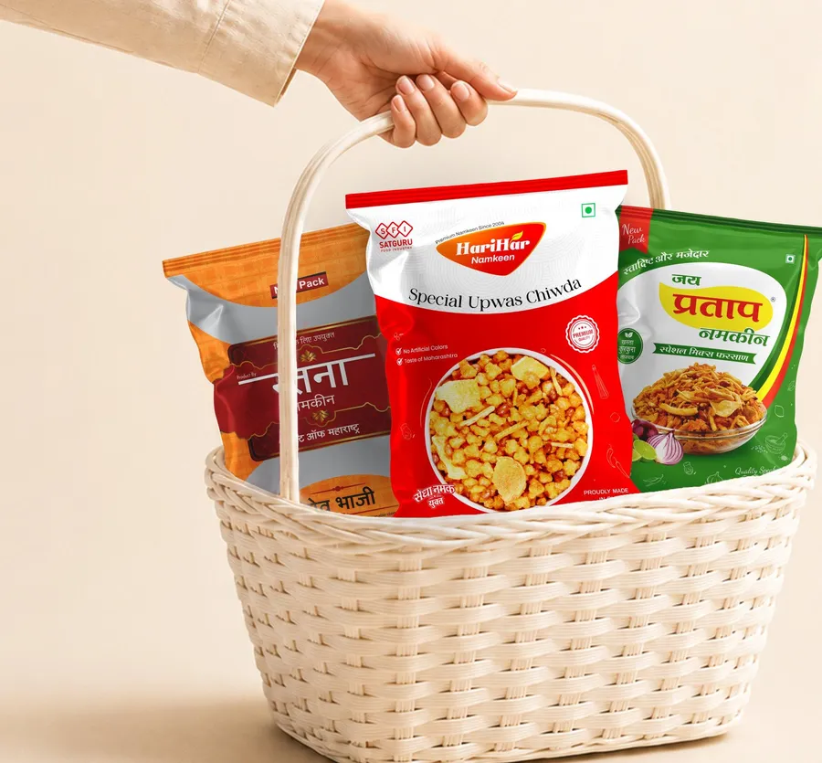A basket holding Ratna, HariHar and Jai Pratap namkeen packs